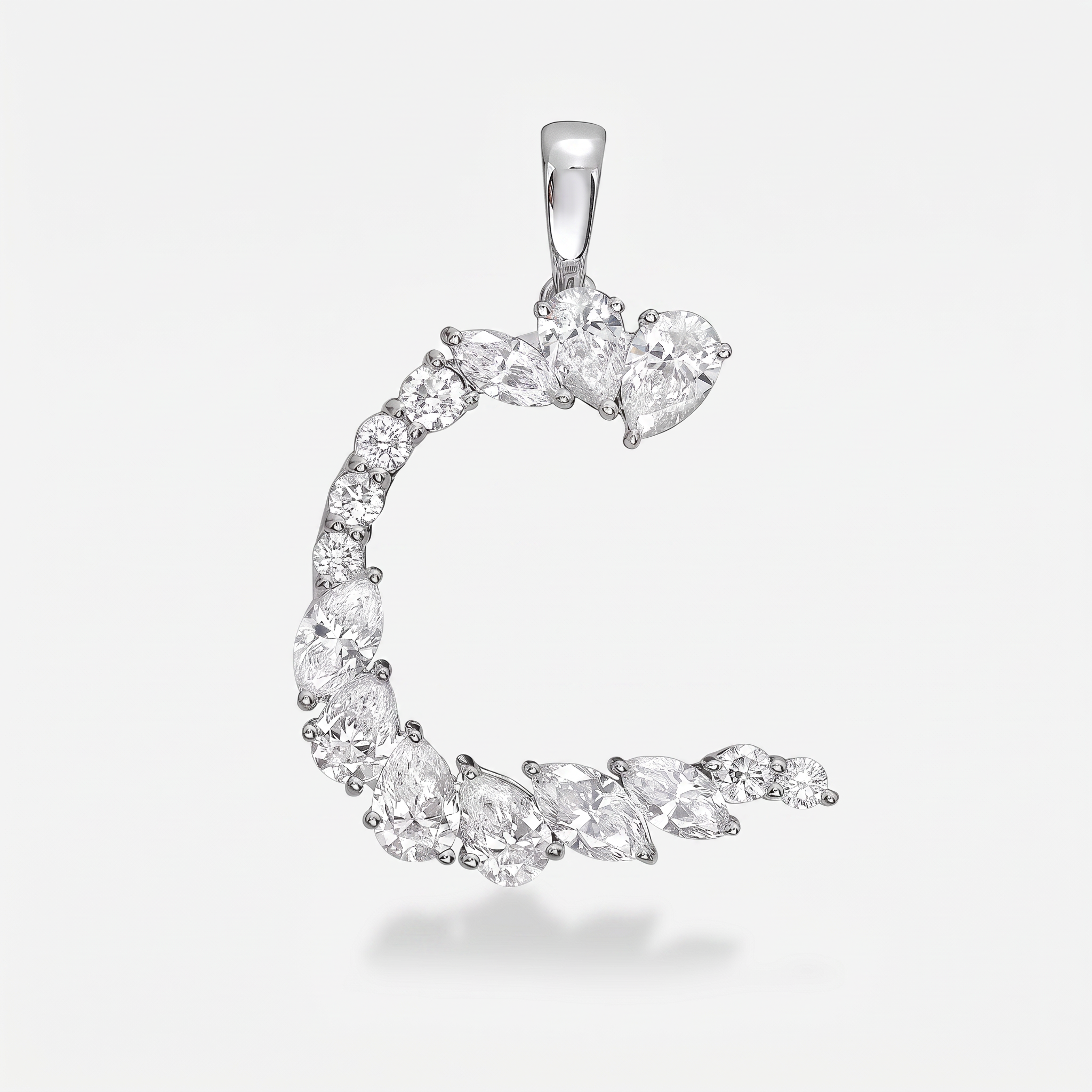 A silver letter C pendant charm made from mixed cut diamond gemstones, shown on a light gray background.