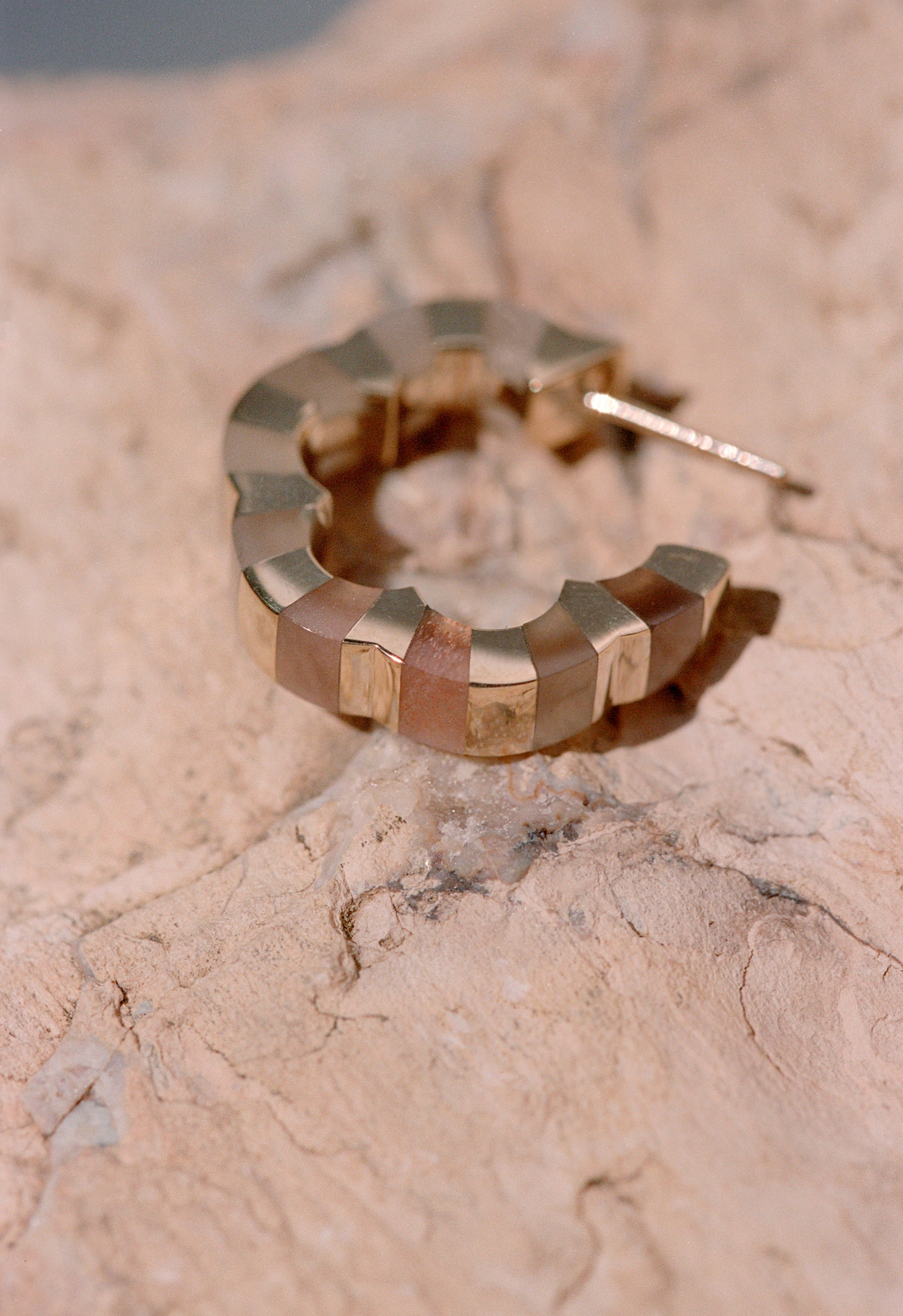 Carved moonstone hoops designed by Isabel Delgado crafted in gold