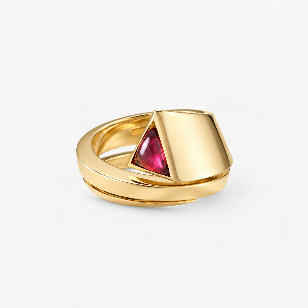 A gold geometric ring featuring a triangular pink gemstone on a clean white background.