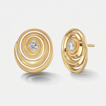A pair of gold spiral stud earrings with a diamond at the center, shown on a light gray background.