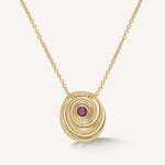 Catalina pendant designed by Isabel Delgado in a shape of a swirl crafted in gold and set with a pink tourmaline