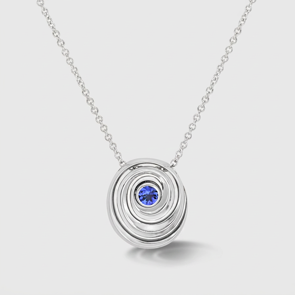 A white gold pendant necklace featuring a central round blue gemstone, displayed on a light gray background.