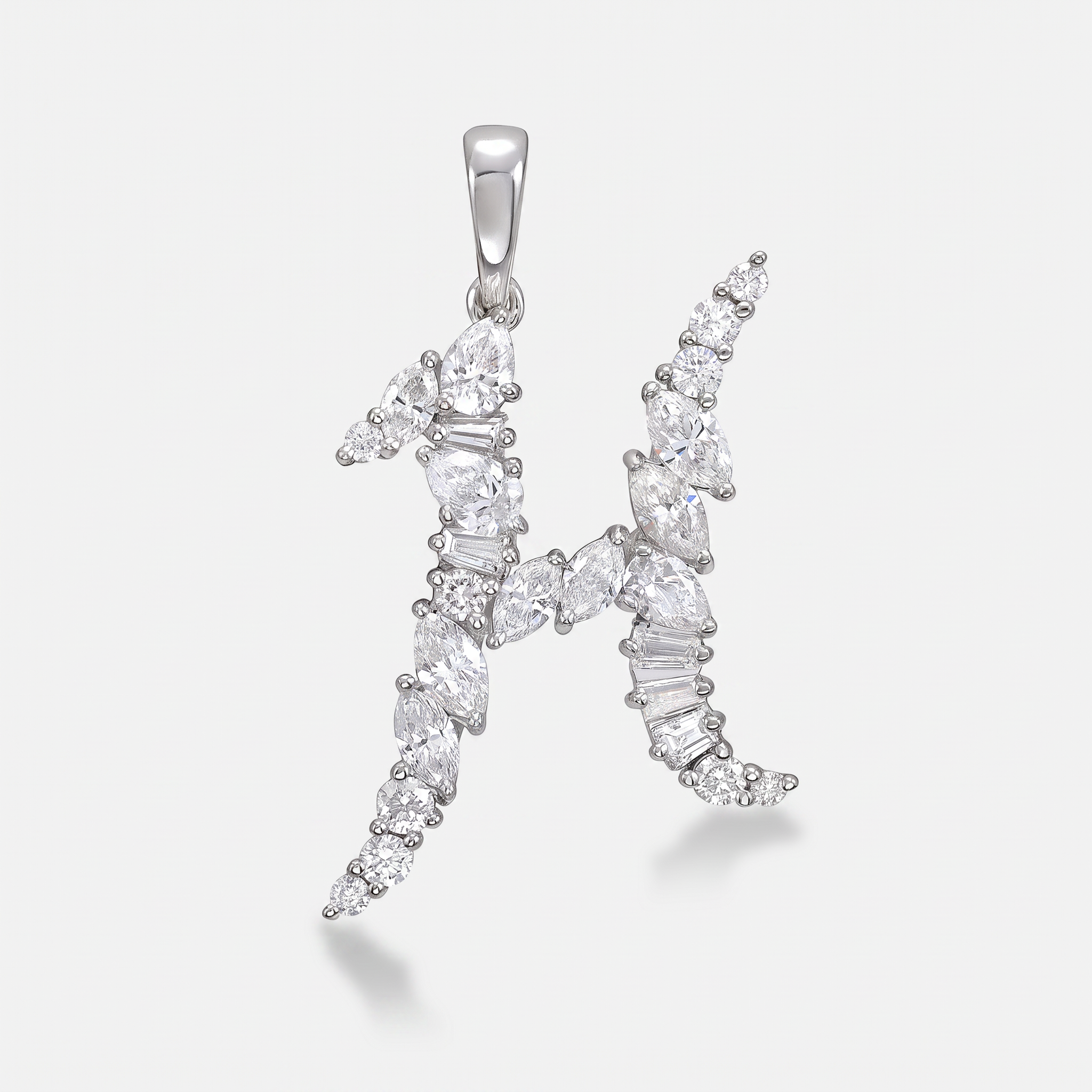 H diamond initial made from mixed cut diamonds set in white gold