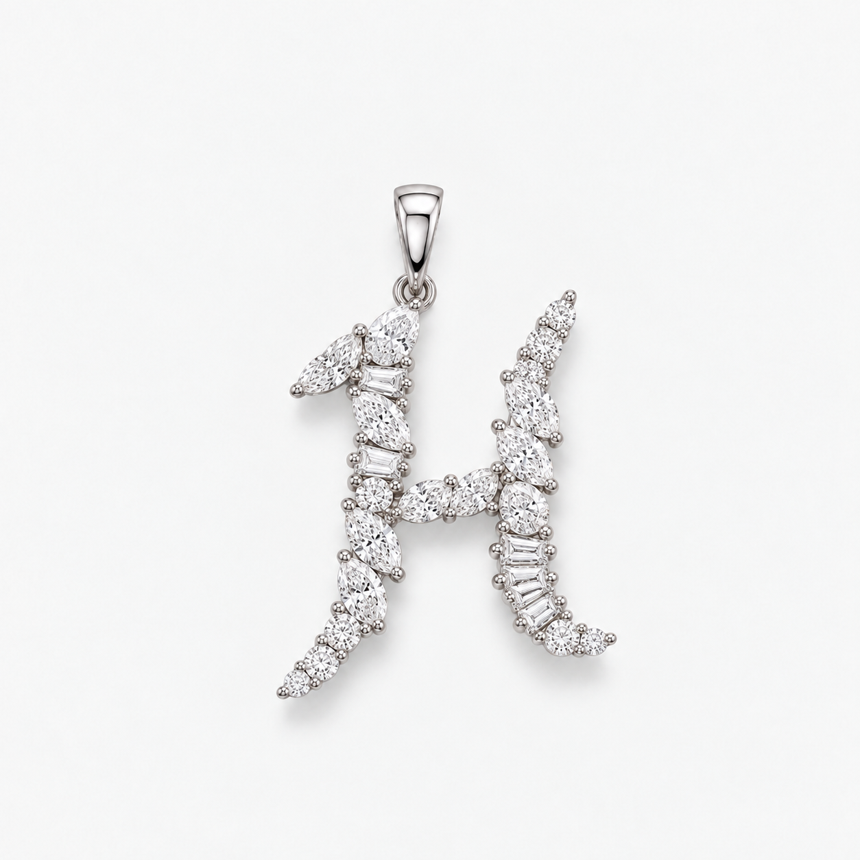 A mixed cut diamond initial in the shape of an H