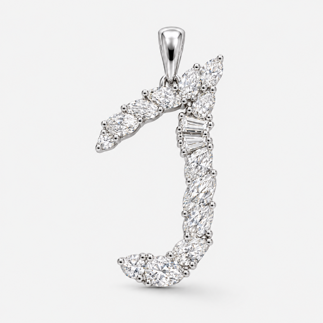 A silver pendant featuring a stylized J initial design, embellished with marquise and baguette-cut clear gemstones, shown against a light gray background.