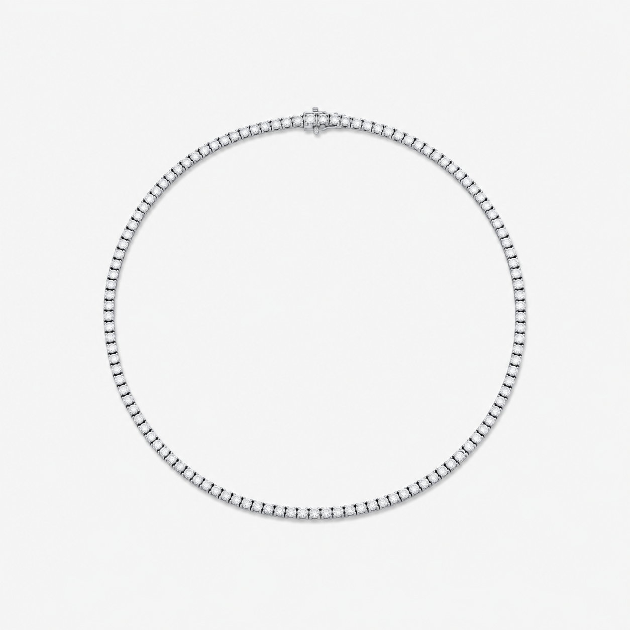 A silver-toned tennis necklace displayed on a clean, light gray background.