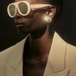Diamond gold clip on earring designed by Isabel Delgado set with colorless diamonds