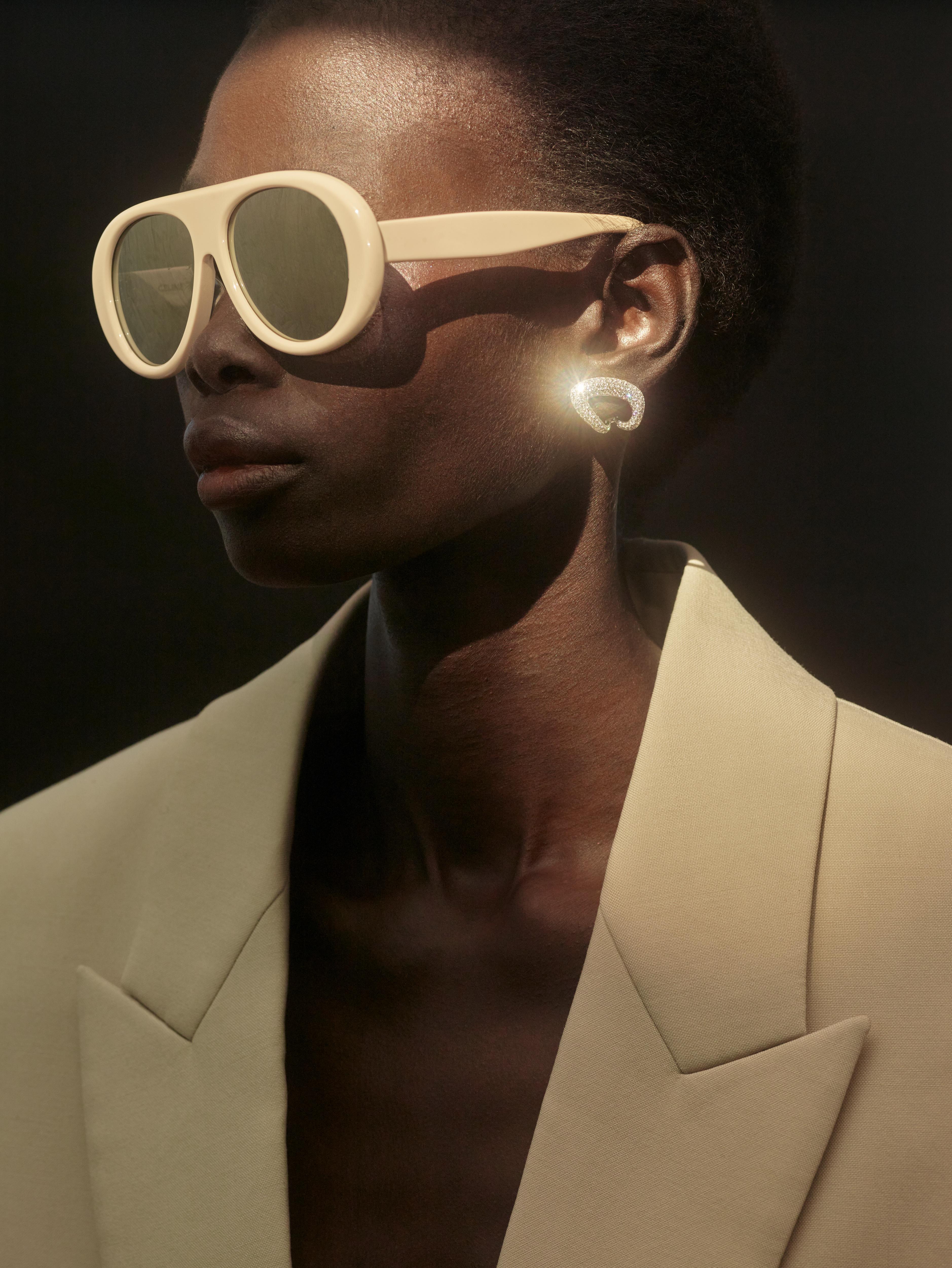 Diamond gold clip on earring designed by Isabel Delgado set with colorless diamonds