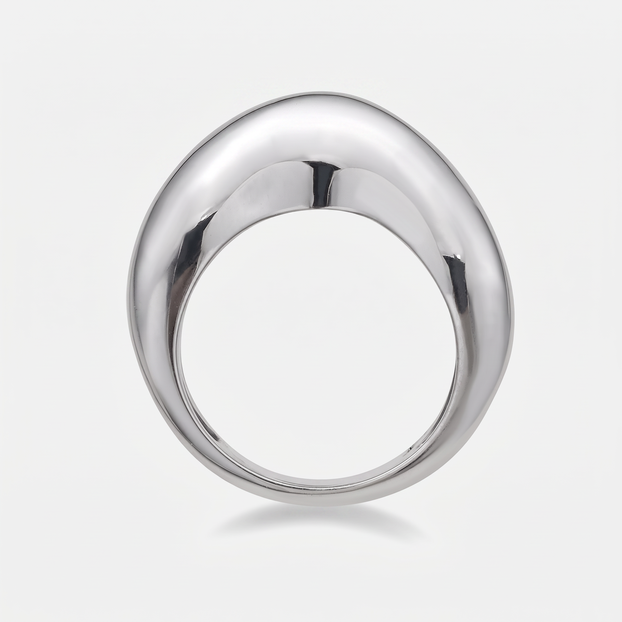A polished white gold ring with a smooth, rounded teardrop-shaped face, shown on a clean light gray background.