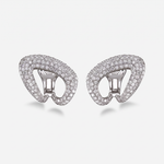 A pair of white gold clip-on earrings paved with white diamonds, shown against a light gray background.