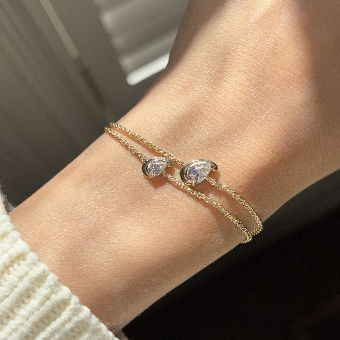 diamond in a pear cut shape set on a chain