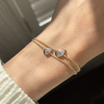 diamond in a pear cut shape set on a chain