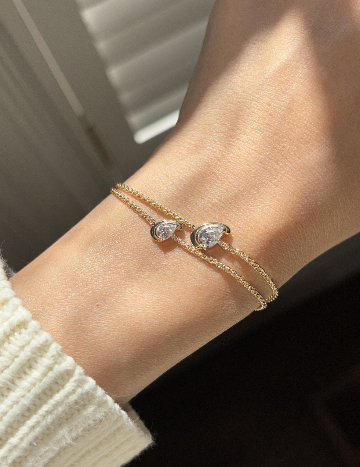 diamond in a pear cut shape set on a chain