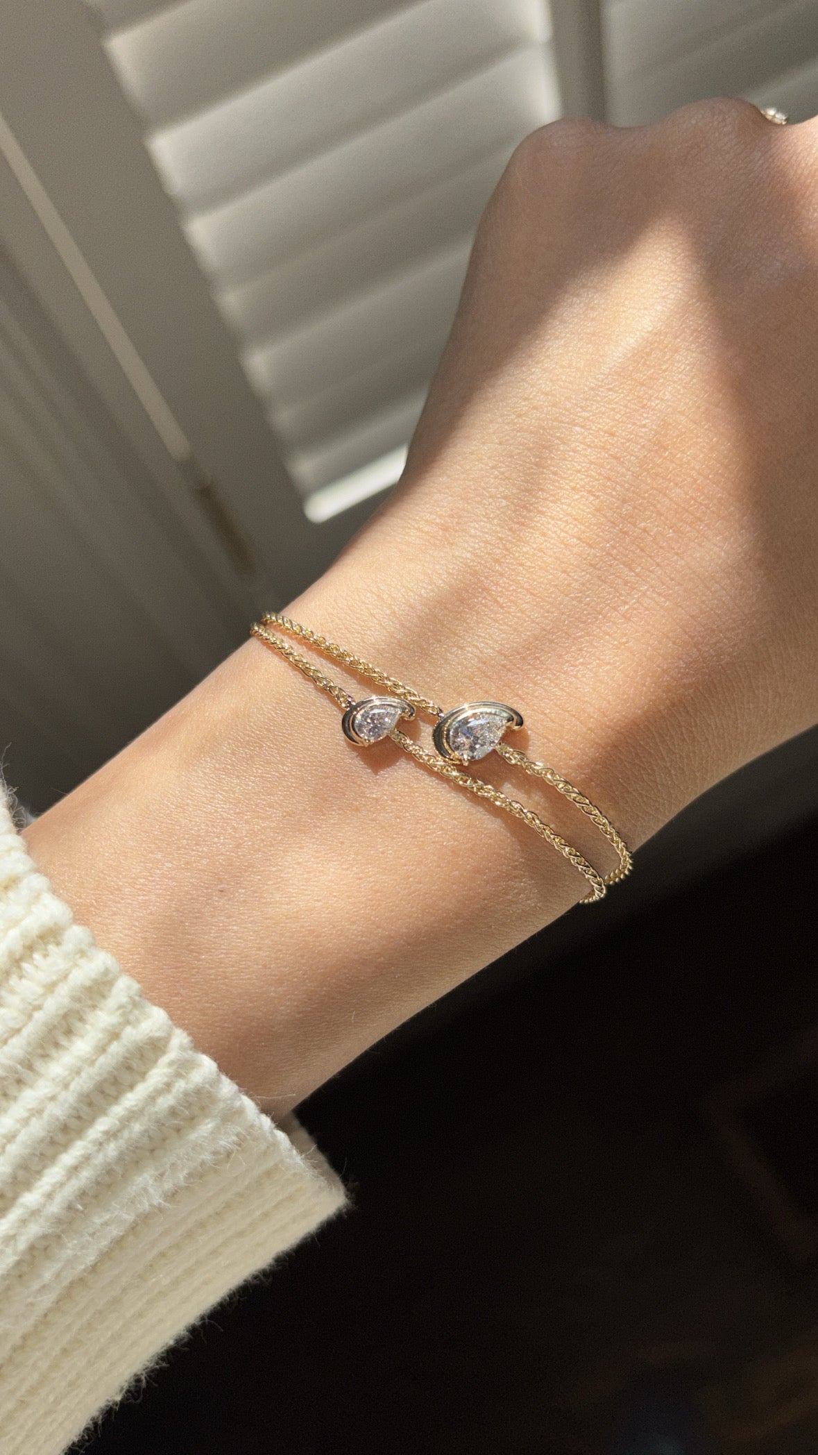 diamond in a pear cut shape set on a chain