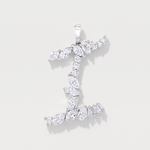 A white gold pendant shaped like the letter 'I', adorned mixed cut diamonds, shown on a light gray background.