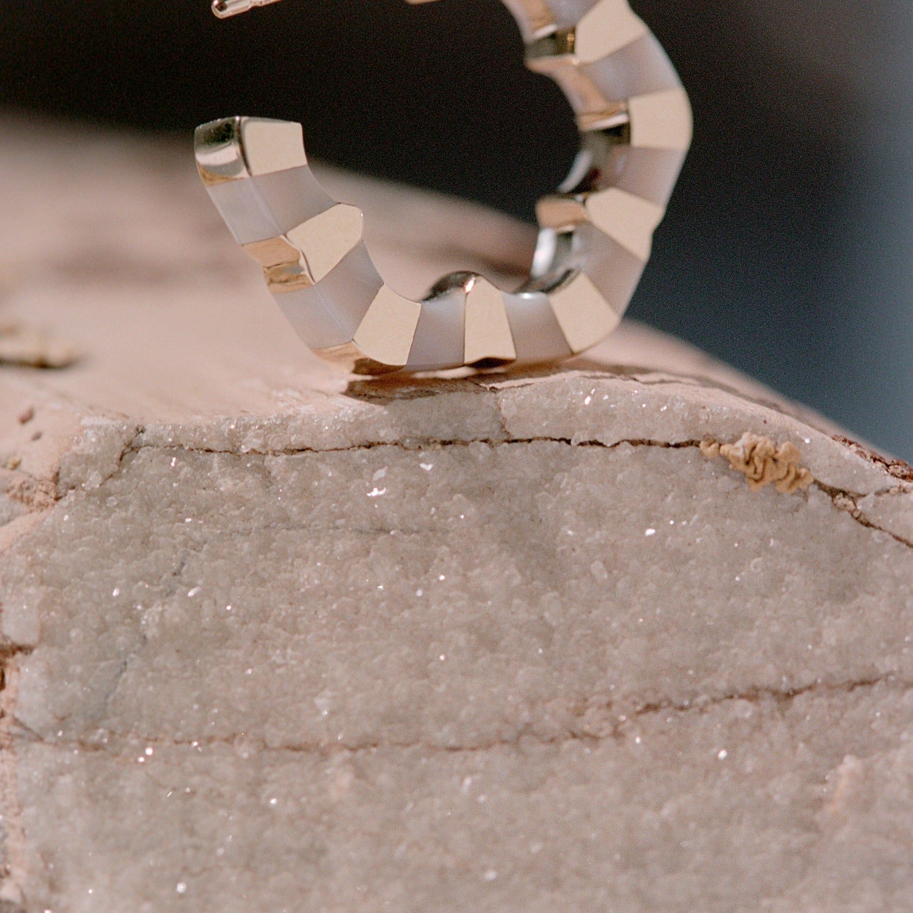 Mother of Pearl and gold hoops designed by Isabel Delgado