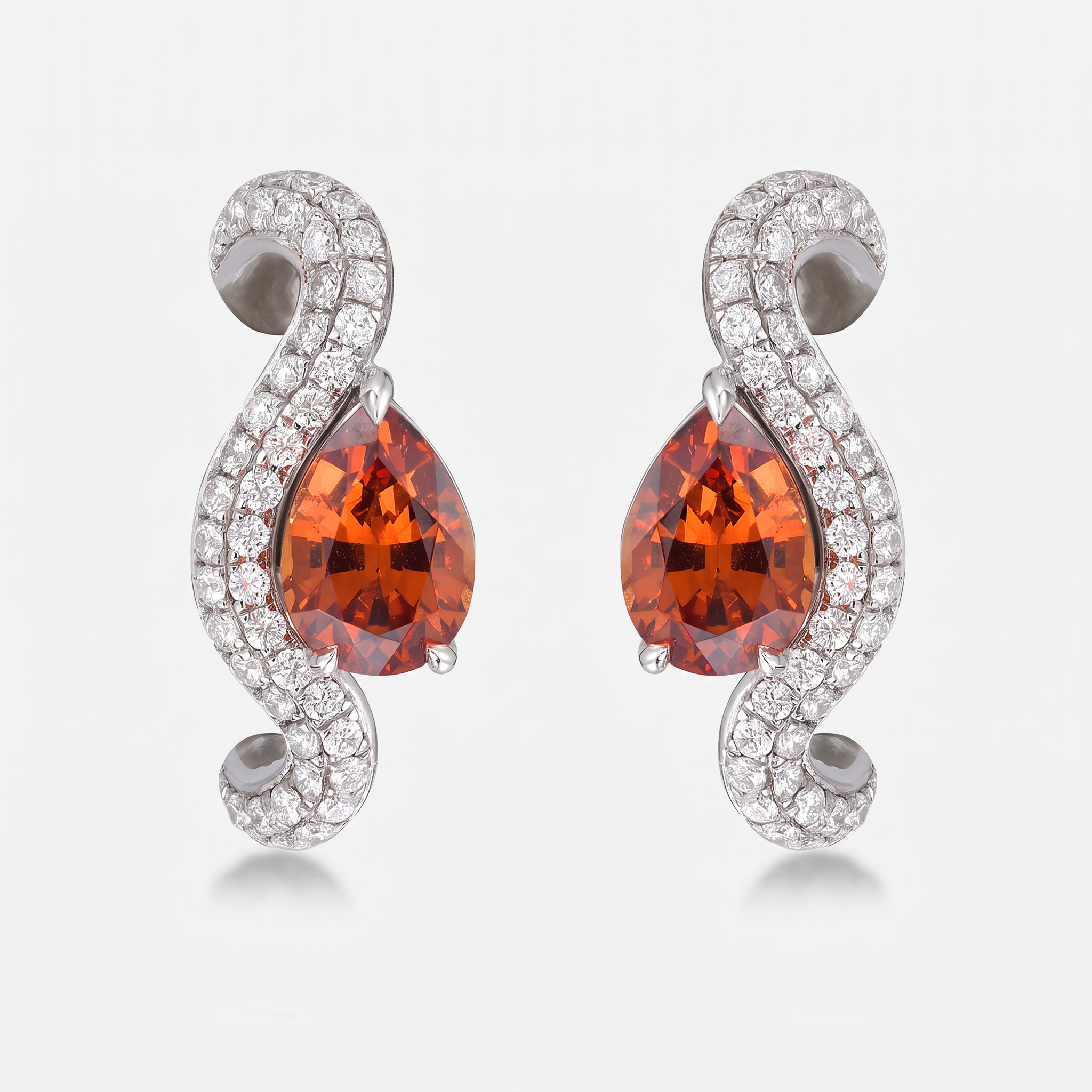 A single wave earring featuring a pear-cut orange gemstone surrounded by pavé-set clear stones on a curved white gold setting, shown against a light gray background.