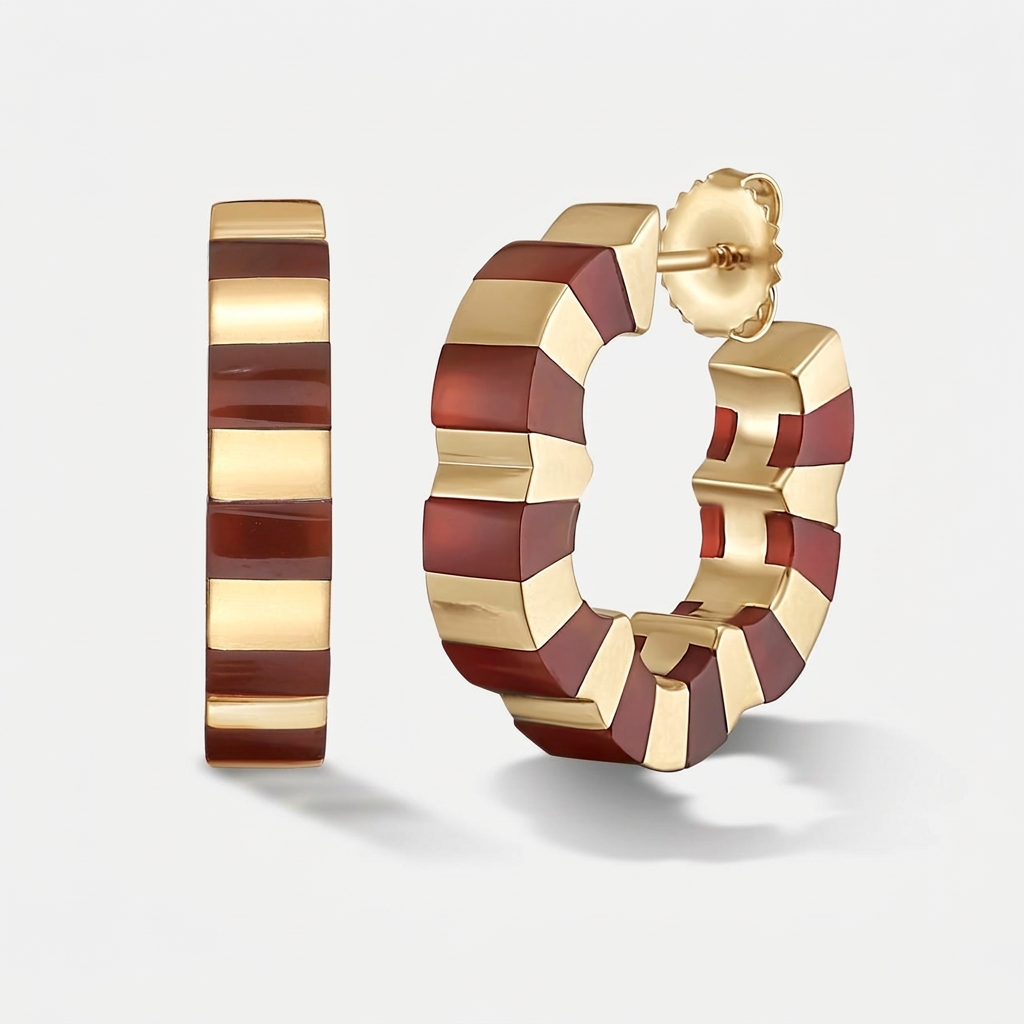 A pair of gold hoop earrings with alternating polished gold and deep carnelian stone red rectangular inlays, shown on a light gray background. One earring is shown from the side, and the other is shown from the front with its post and butterfly back visible.
