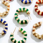 Colorful hoops with carved gemstone crafted in gold designed by Isabel Delgado