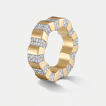 A wide yellow gold ring featuring a geometric, segmented chevron pattern with pavé-set clear diamonds on alternating sections, shown on a light gray background.