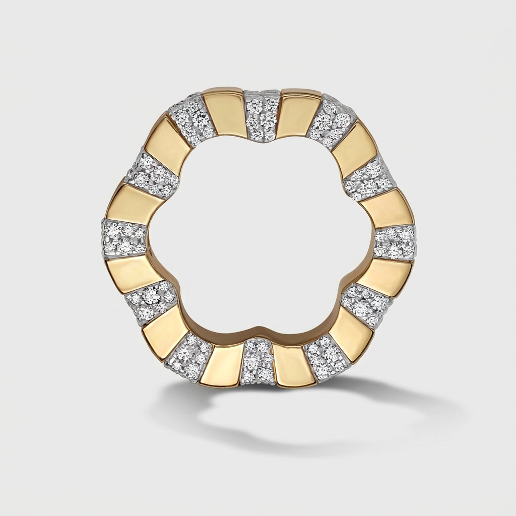 A scalloped circular ring featuring alternating polished yellow gold and diamond-set segments, photographed on a light gray background.