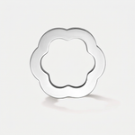 A polished silver-tone metal ring with a flower-shaped outline, shown on a clean light gray background.