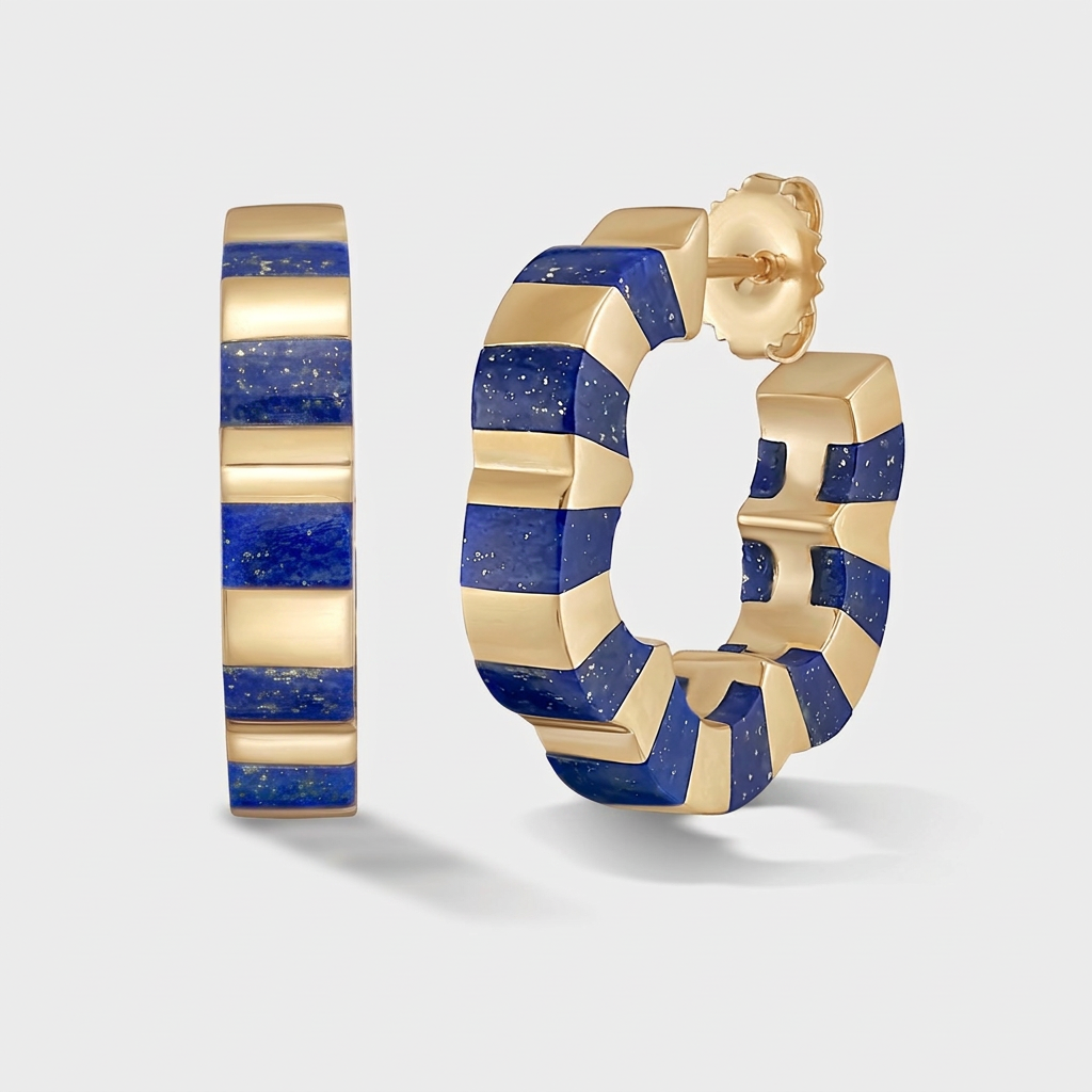 A pair of gold and lapis lazuli striped hoop earrings shown on a light gray background, with one earring standing vertically and the other in profile showing the post.
