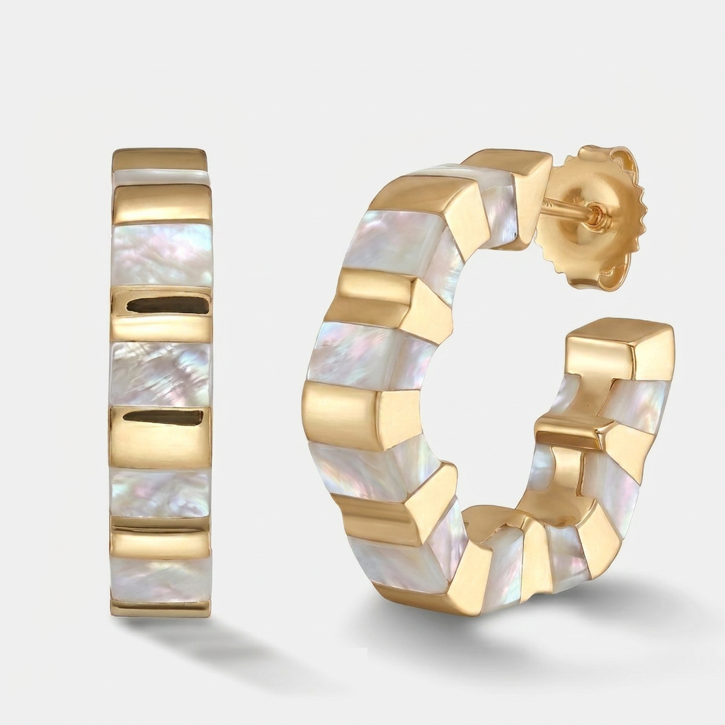 Gold huggie hoop earrings with a segmented design and iridescent mother-of-pearl inlay, shown on a light gray background.