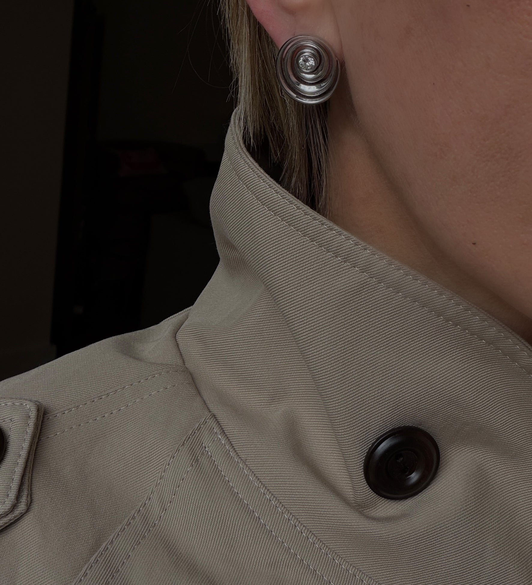 spiral catalina studs that show the dimension of the earrings worn by stylist