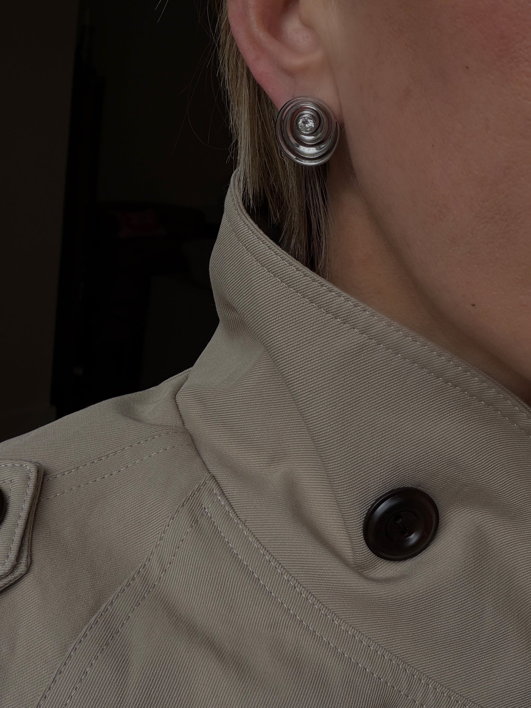 spiral catalina studs that show the dimension of the earrings worn by stylist