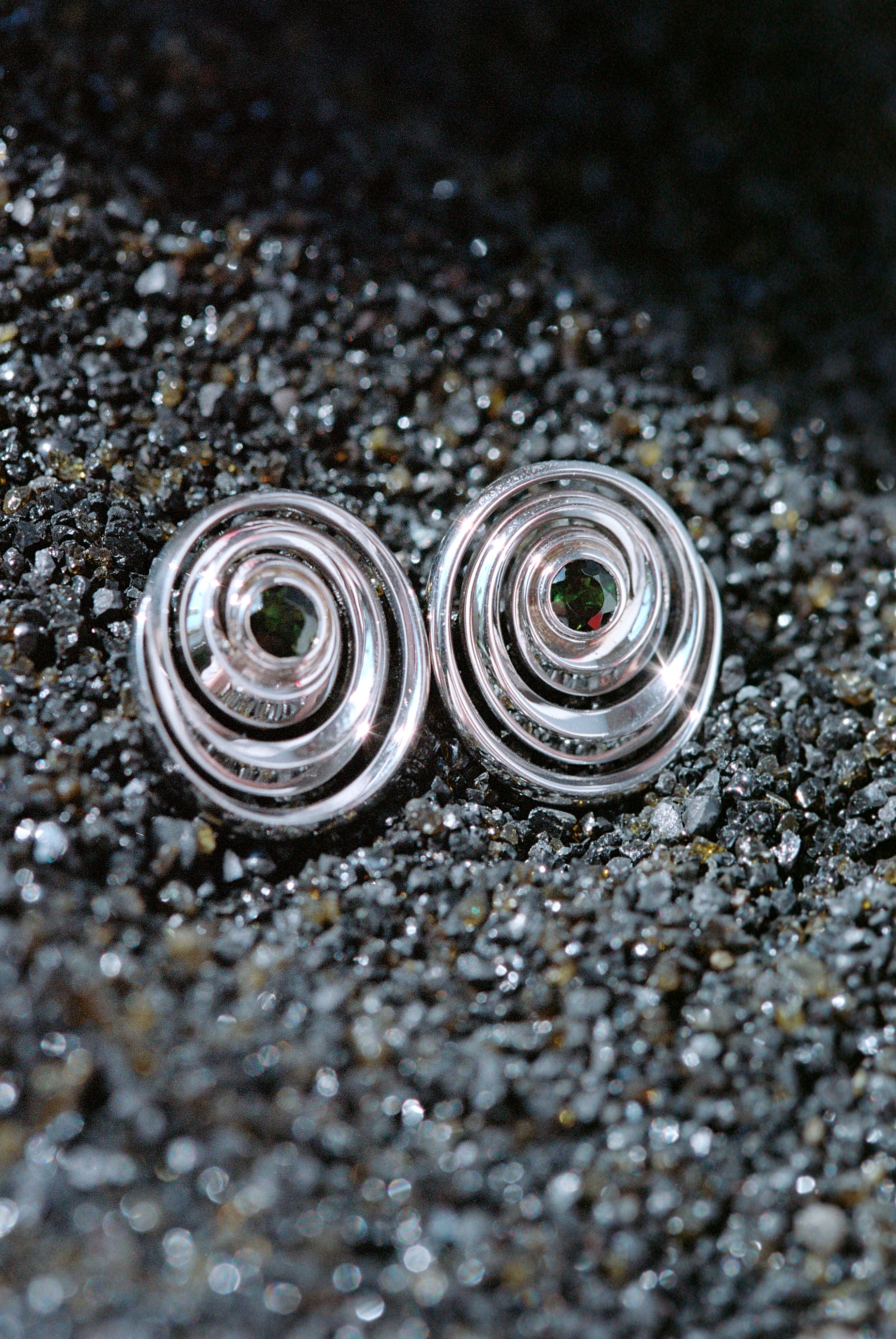Isabel Delgado designed spiral studs with tourmaline center stones
