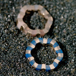two rings carved with lapis lazuli and moonstone designed by Isabel