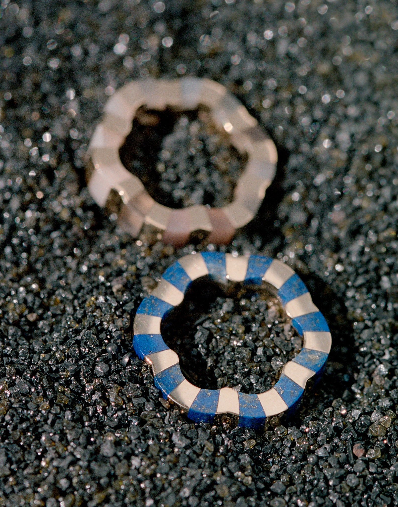 two rings carved with lapis lazuli and moonstone designed by Isabel