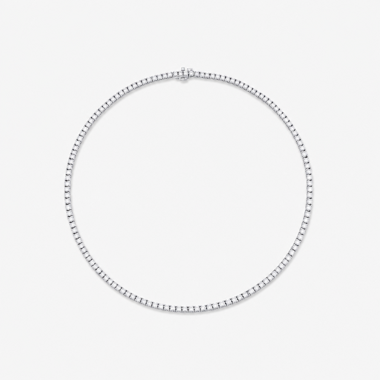 A silver-toned tennis necklace with a box link design, adorned with small diamond stones, shown against a plain light gray background.