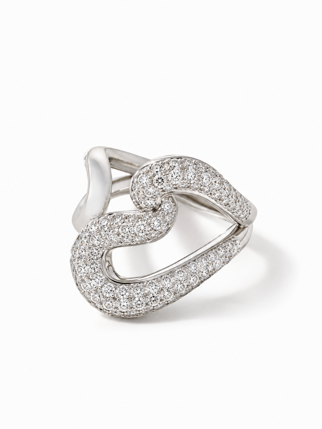 A silver-toned ring featuring an open, flowing heart-shaped design paved with clear stones, shown on a clean white background.