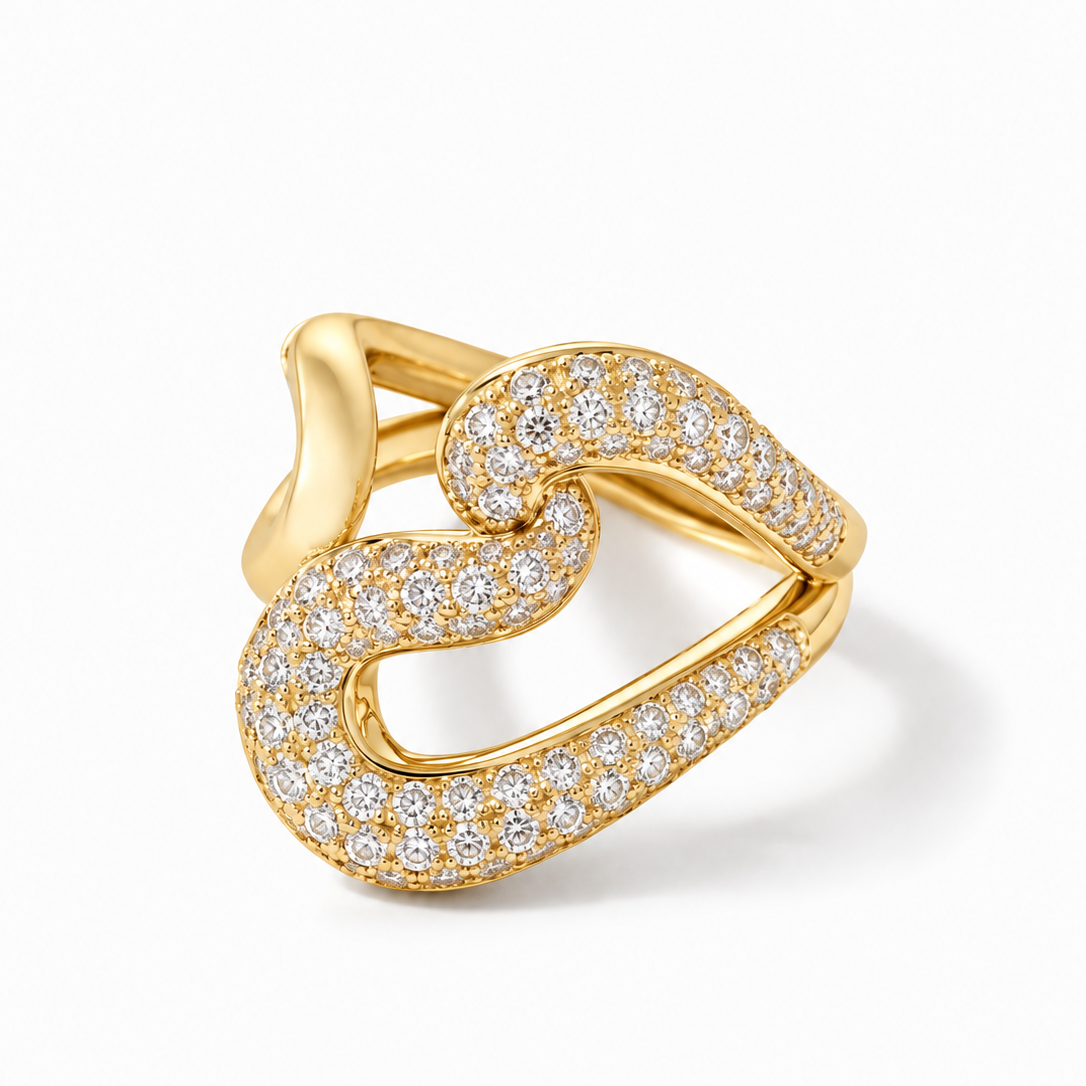 A gold ring featuring an open, intertwined double-band design paved with small clear stones, shown on a clean white background.