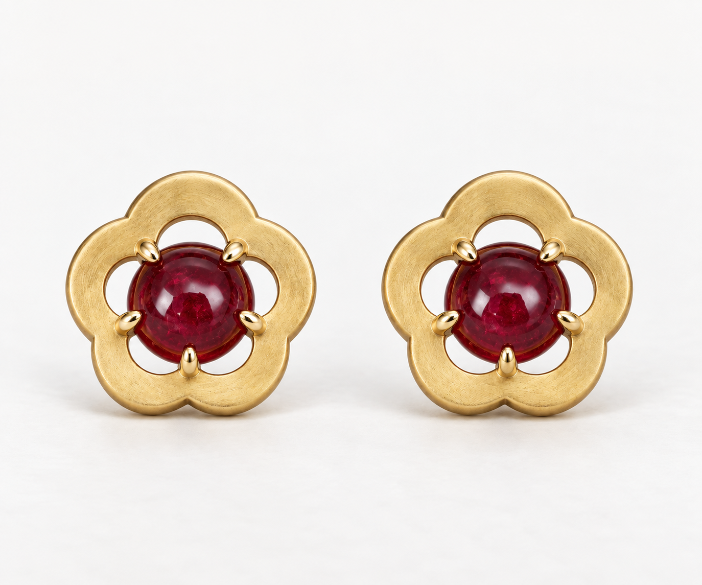 flower shaped studs with cabochon cut rubies