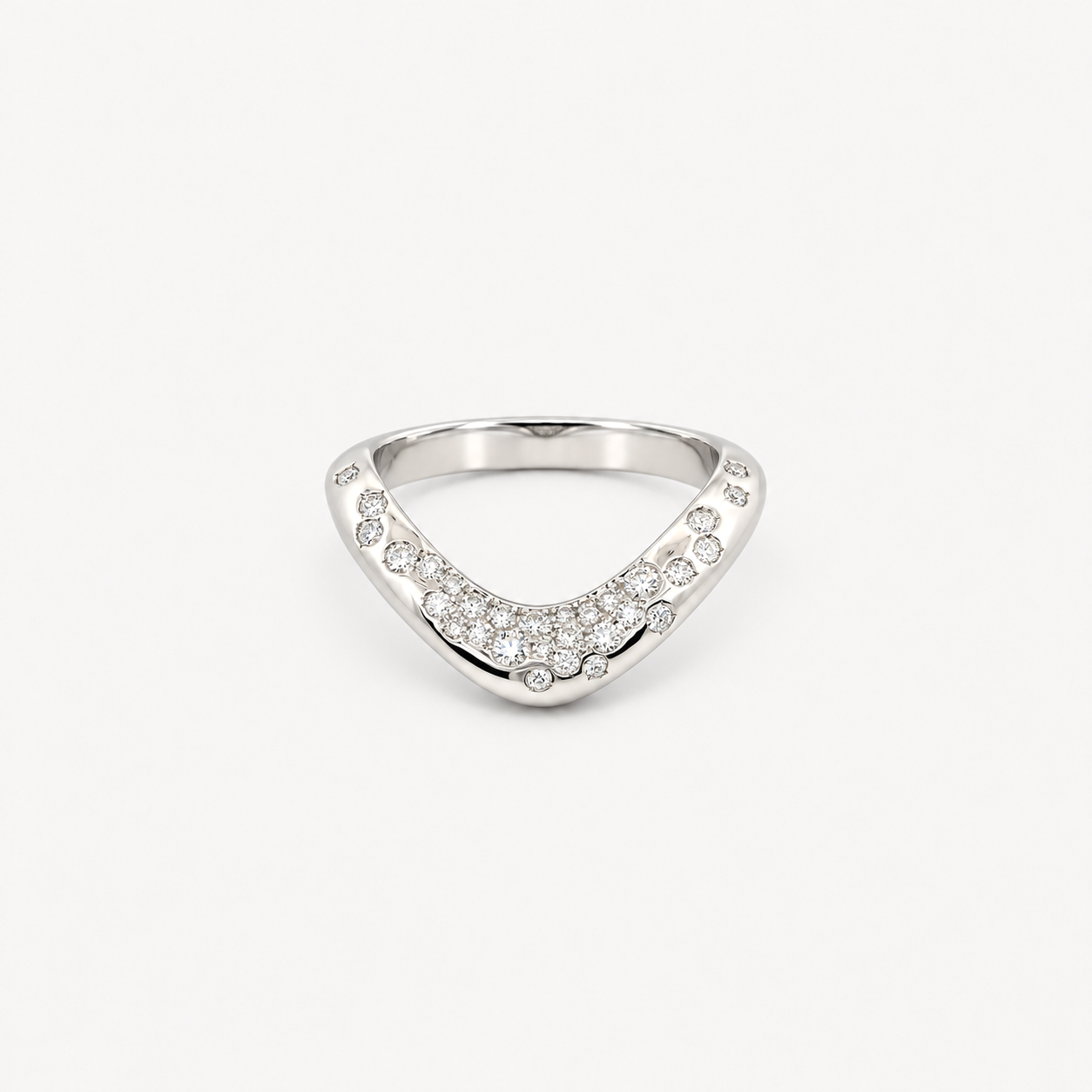 A silver V-shaped ring set with small clear pavé stones, photographed on a clean white background.