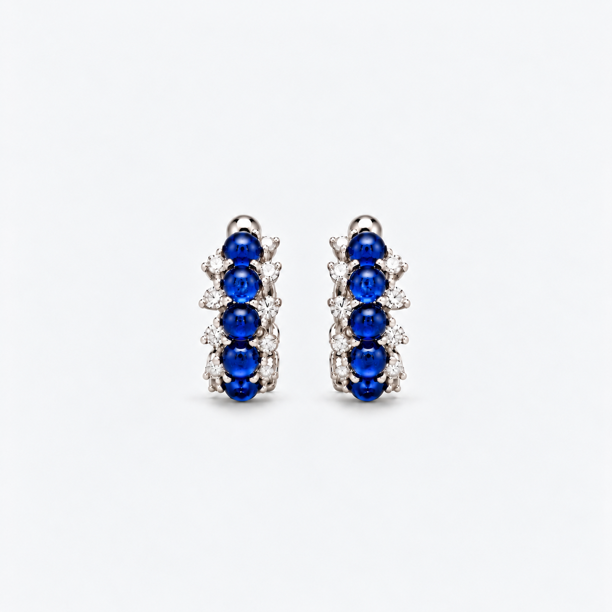 small cabochon cut sapphire hoops with diamonds